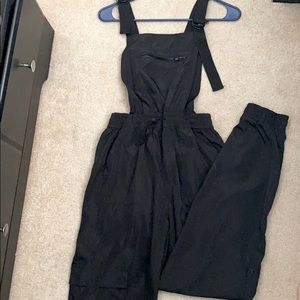 Black windbreaker overalls